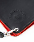 Black and red wallet with 'Planned Perfect' branding on a white background