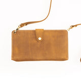 Brown leather crossbody bag on a white background